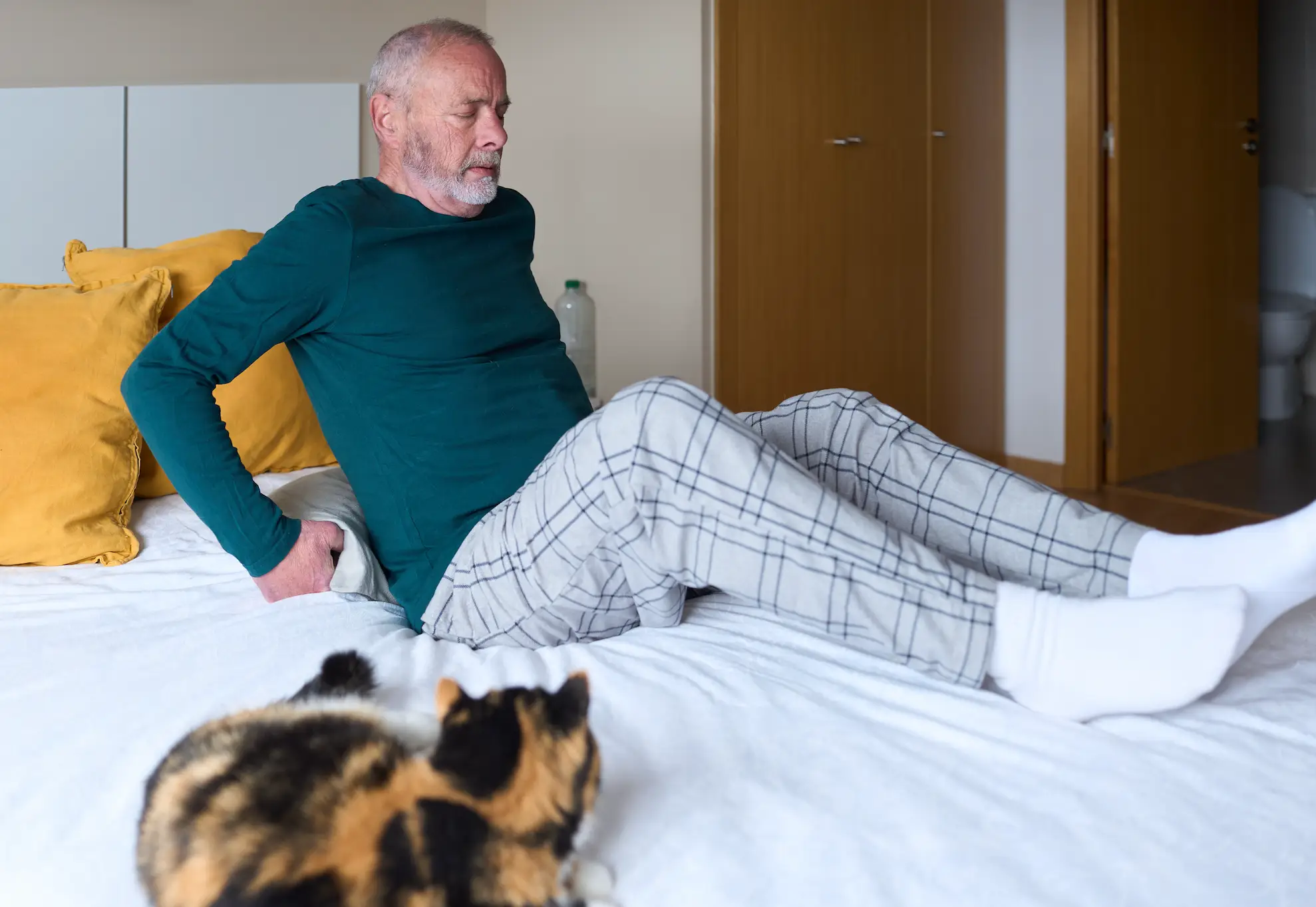 Stiffness can result in poor and restless sleep (Getty Stock Image)