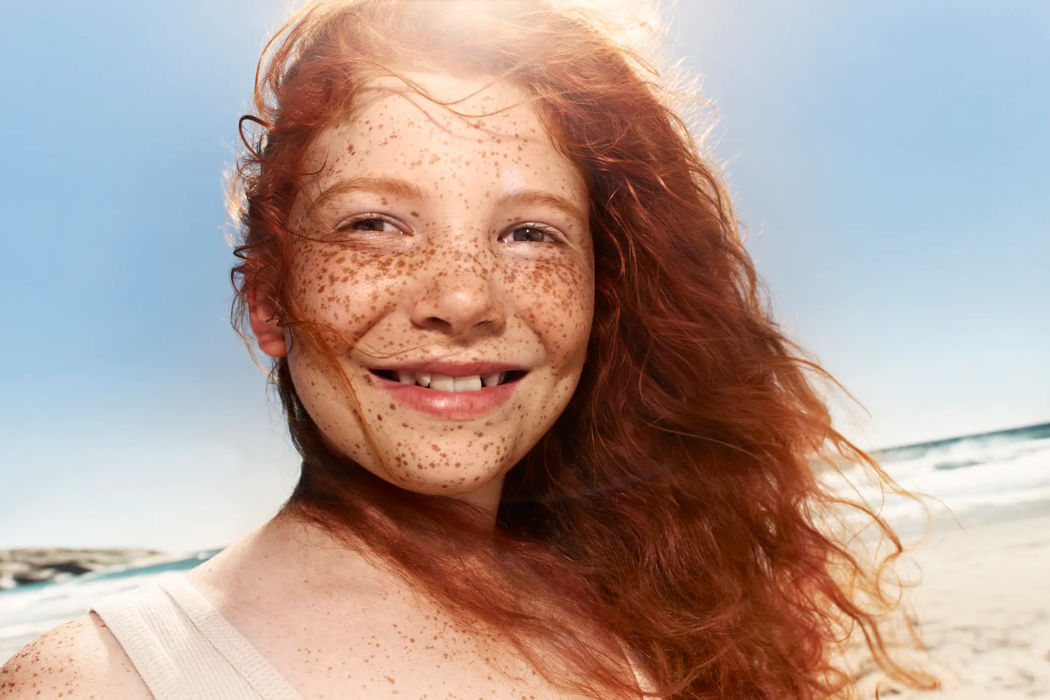 People with red hair have a certain gene which makes them more likely to have freckles and pale skin (Getty Images)