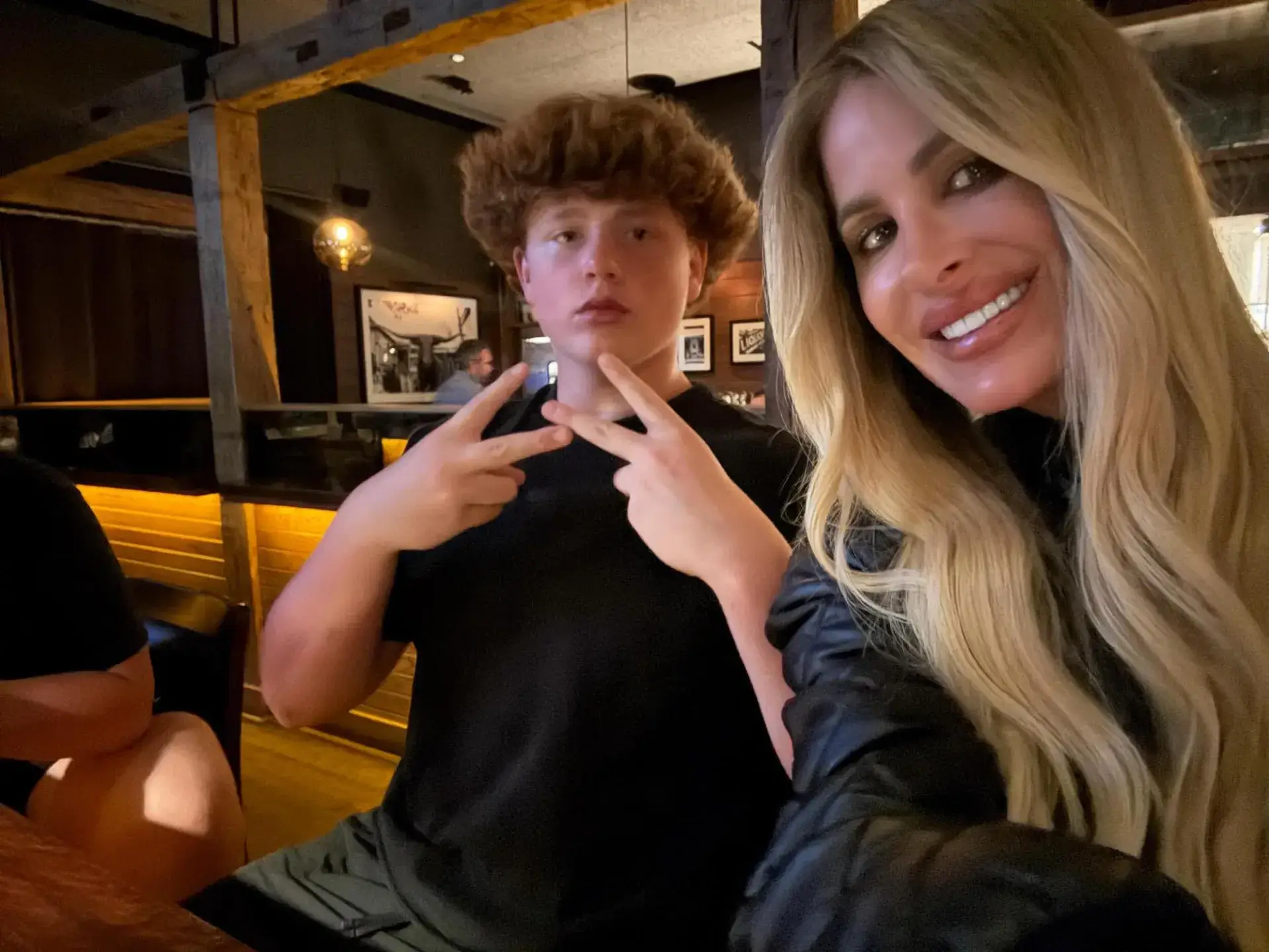 KJ seen with his famous mom (Instagram/@kimzolciakbiermann)