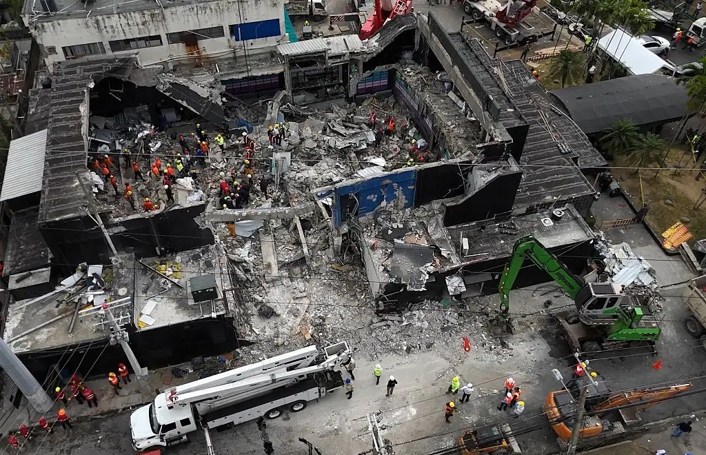 Aerial view shows rescue teams working at the Jet Set nightclub a day after the collapse of its roof in Santo Domingo (ALFRED DAVIES/AFP via Getty Images)