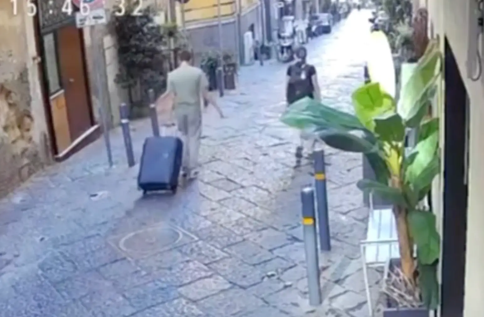 Sickening CCTV footage showed the happy tourist walking down the road when an object seemed to fall out of the sky 