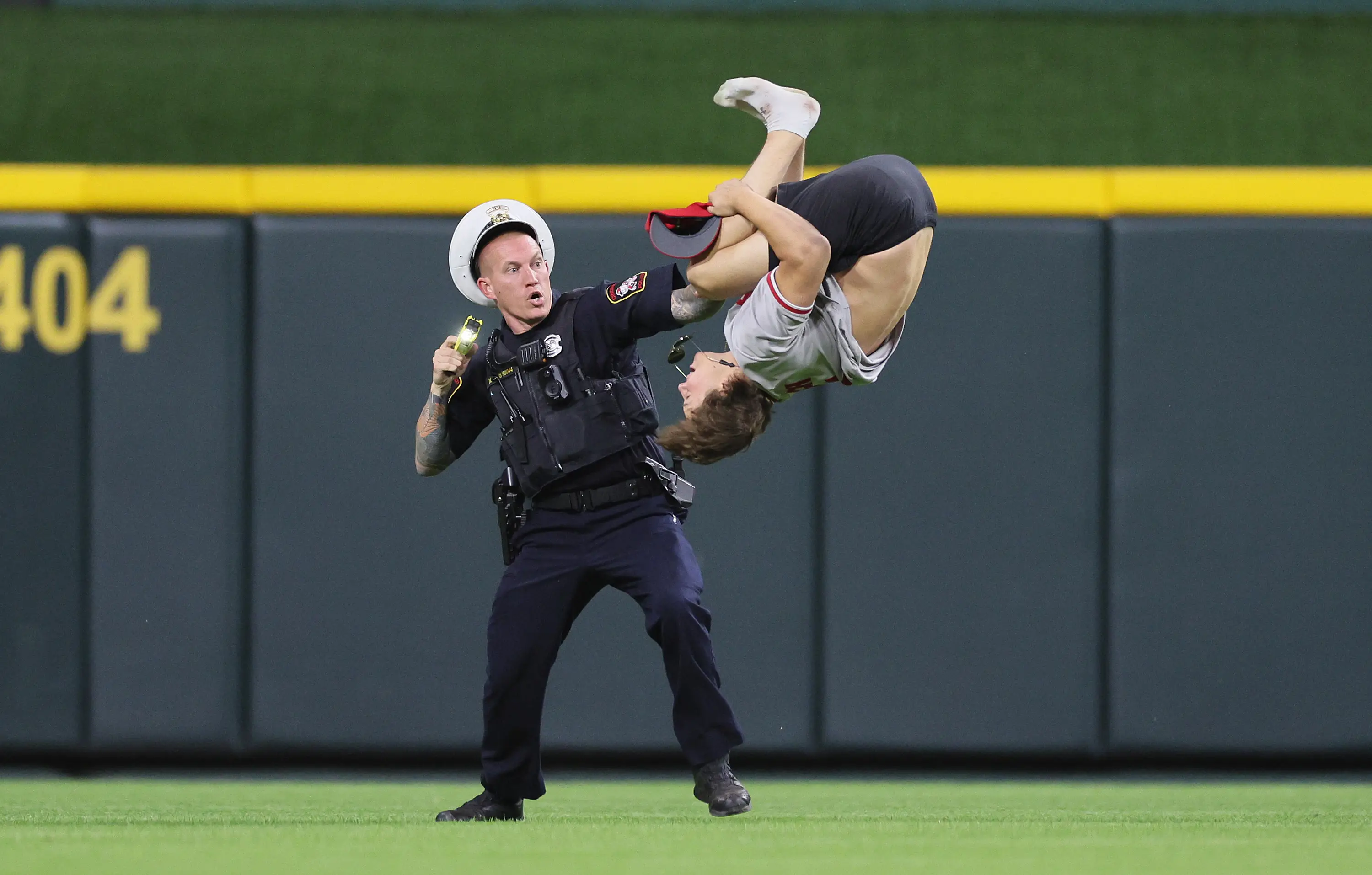 The streaker performed a flip on the field of play. (Andy Lyons/Staff)