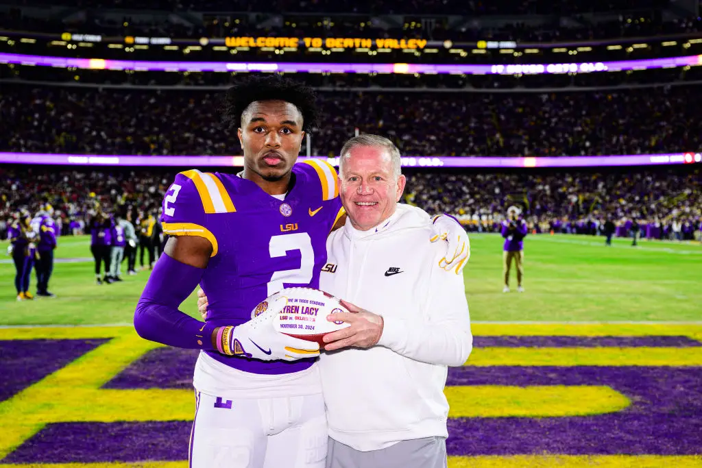 Kyren Lacy had declared for this season's NFL draft, pictured alongside head coach Brian Kelly (Gus Stark/LSU/University Images via Getty Images)