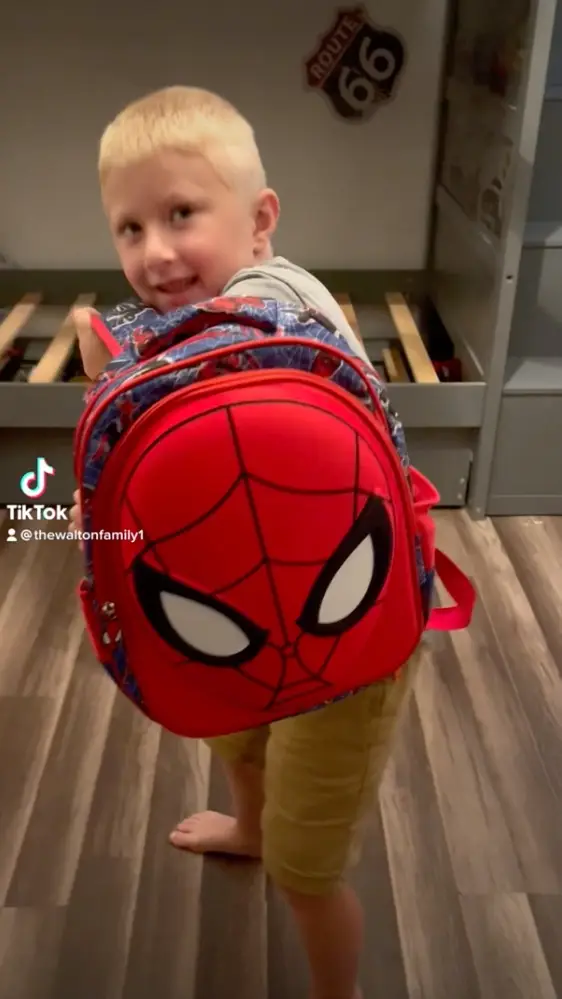 Cassie was teaching her son how to use his bulletproof backpack.