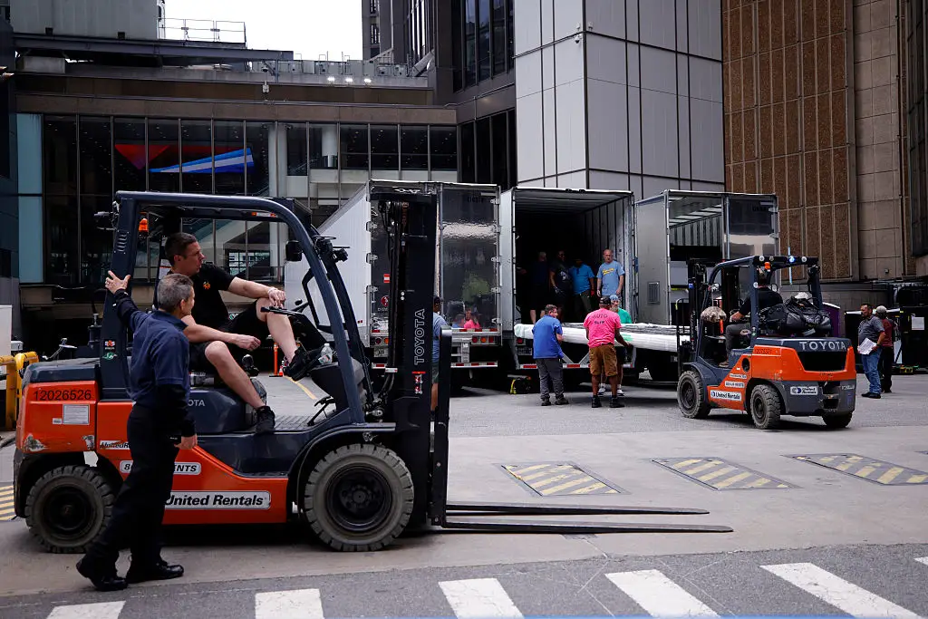 Forklifts and trucks have been seen outside rumored the venue for the big day (Photo by Leonardo MUNOZ / AFP via Getty Images)