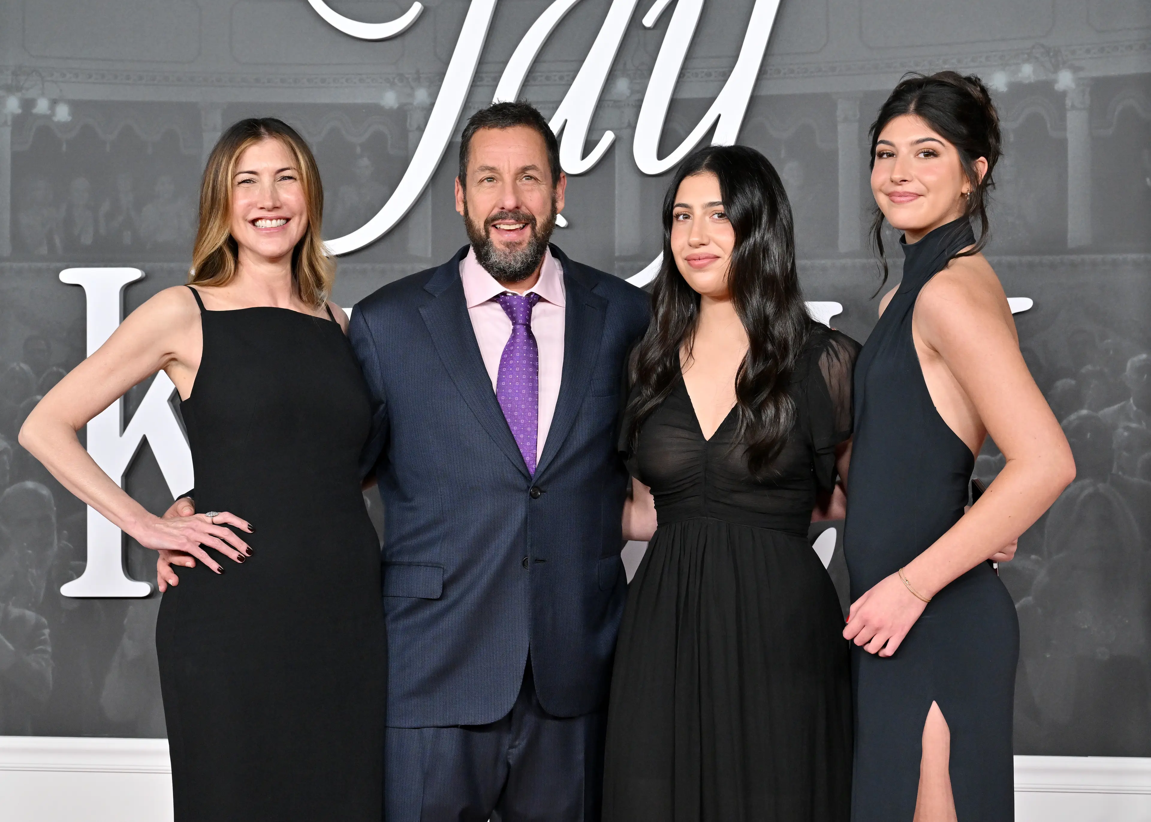 Adam Sandler apparently jumps into the pool wearing socks (Axelle/Bauer-Griffin/FilmMagic)