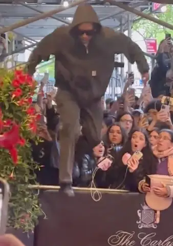 The rapper walked straight into the hotel after hopping the fence.