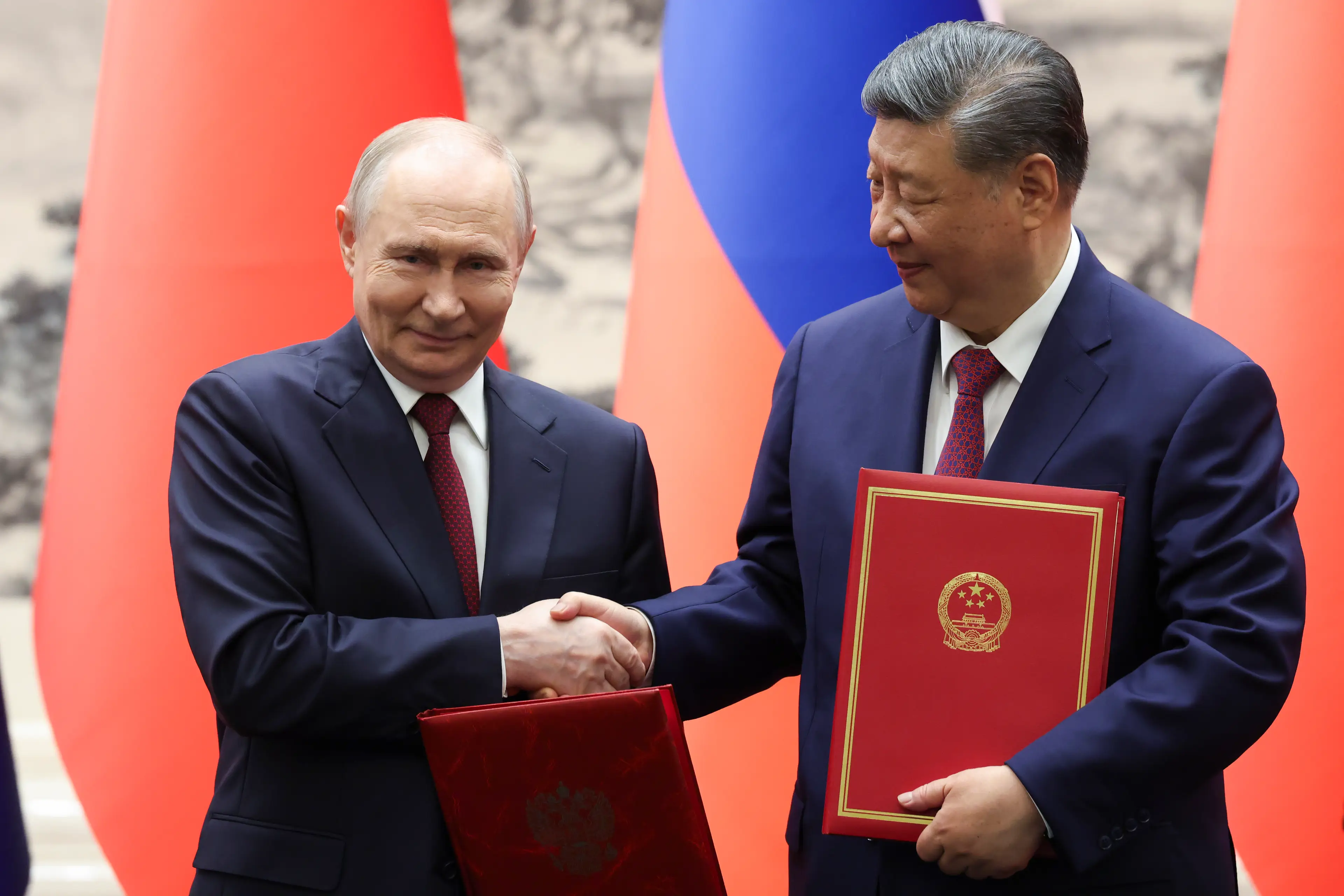 The meeting might have been identical to Trump's, but Xi is much closer to Putin (Alexander KAZAKOV / POOL / AFP via Getty Images)
