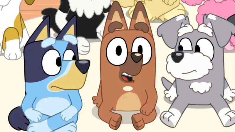 Bluey sitting in class next to her friends, Pretzel and Terrier (Disney)