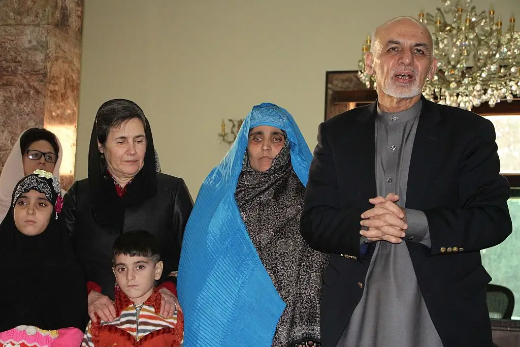 The then-president Ashraf Ghani gifted Sharbat keys to an apartment in Afghanistan (Haroon Sabawoon/Anadolu Agency/Getty Images)