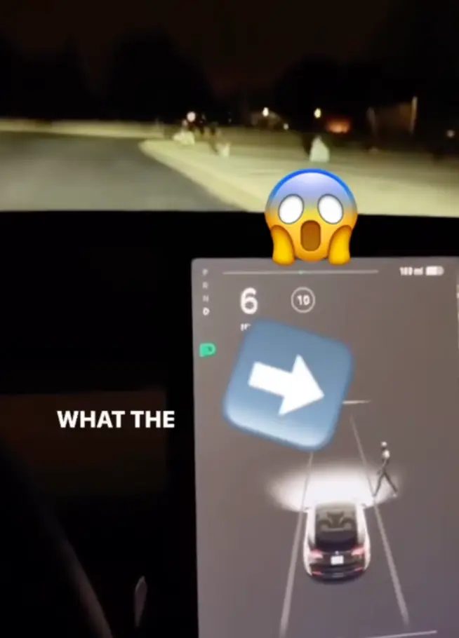 The figure of a person can be seen walking towards the car.