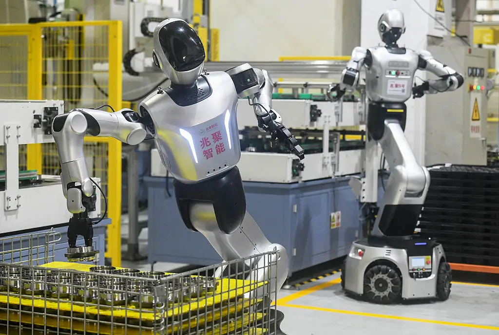 Robots are much more common in the workplace than they used to be (Photo by CN-STR / AFP via Getty Images)