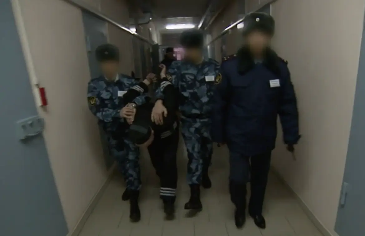 Prisoners at Black Dolphin are bent over to limit their view of the prison and prevent them from attacking.