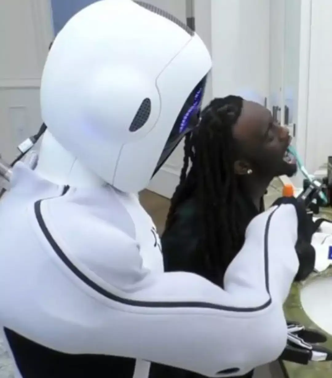 His prior robot helped him to brush his teeth (Twitter/Kai Cenat)