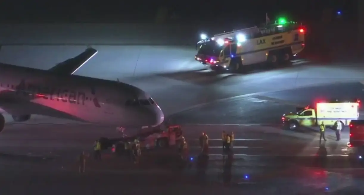 The bus windshield has severely damaged by the plane collision.