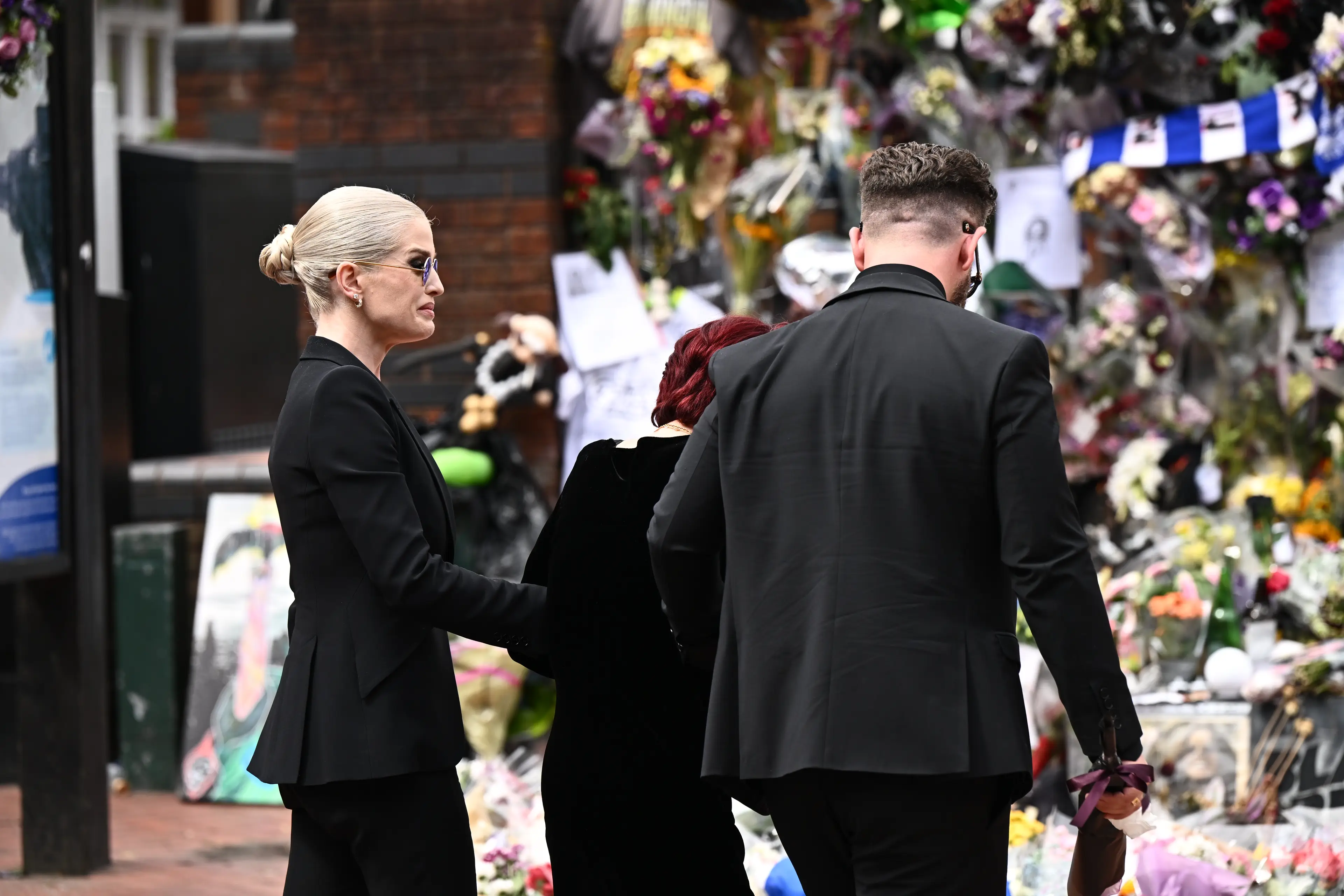 The streets of Birmingham were packed with Ozzy's fans who have left flowers and notes of love for the late singer (Leon Neal/Getty Images)