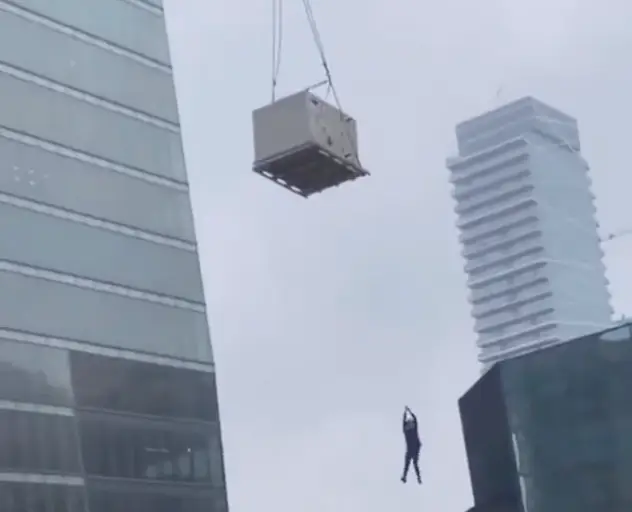 The construction worker is reported as having gone all the way up to the 23rd floor.