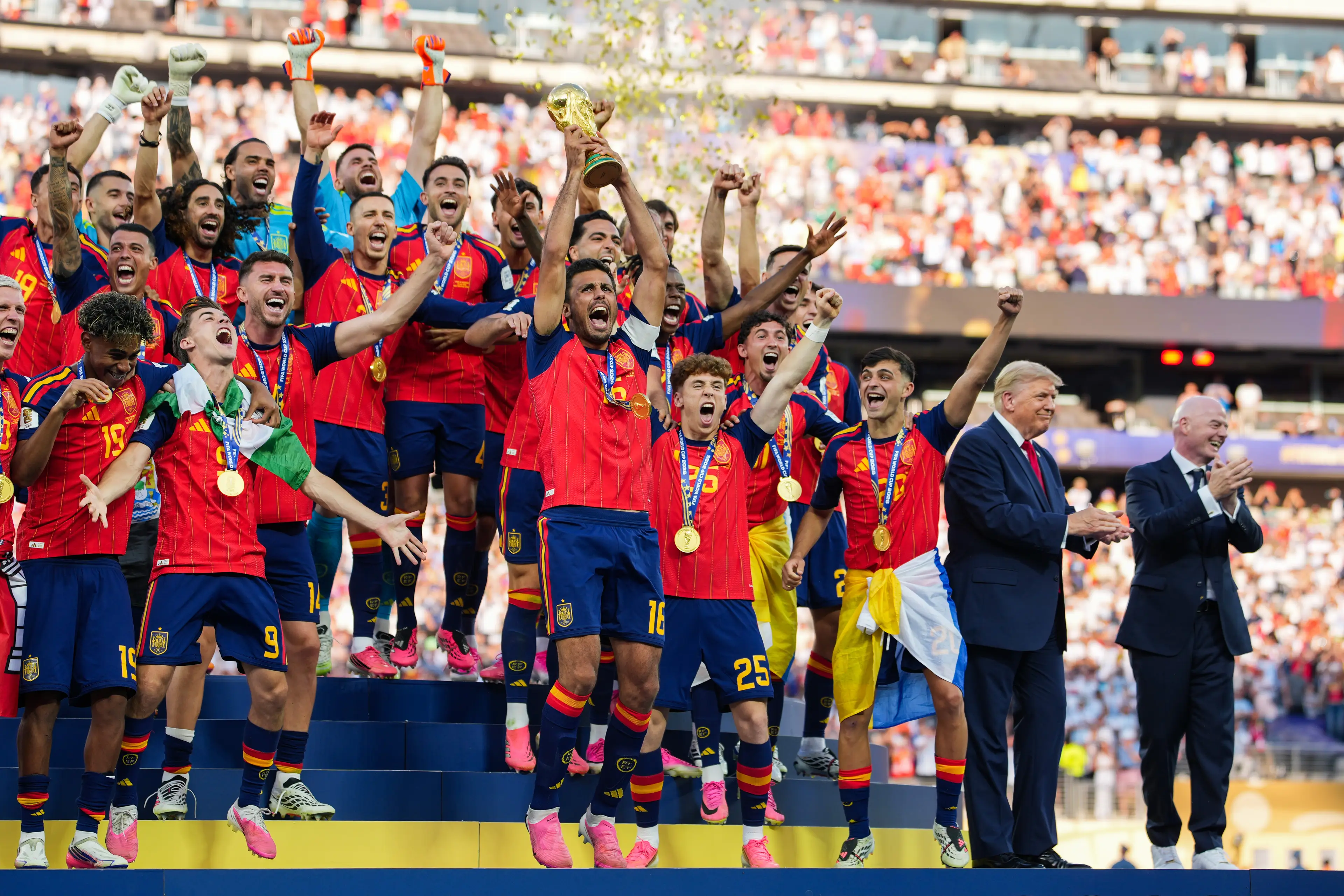 The president award Spain the trophy and stayed on stage for some of the celebrations (Andrew Harnik/Getty Images)