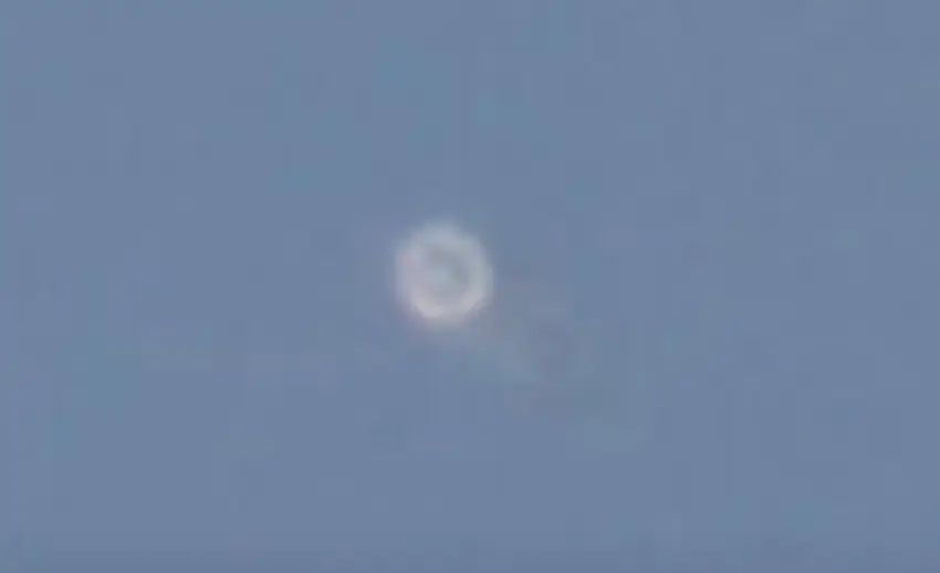 A flashing light can be spotted in the sky.