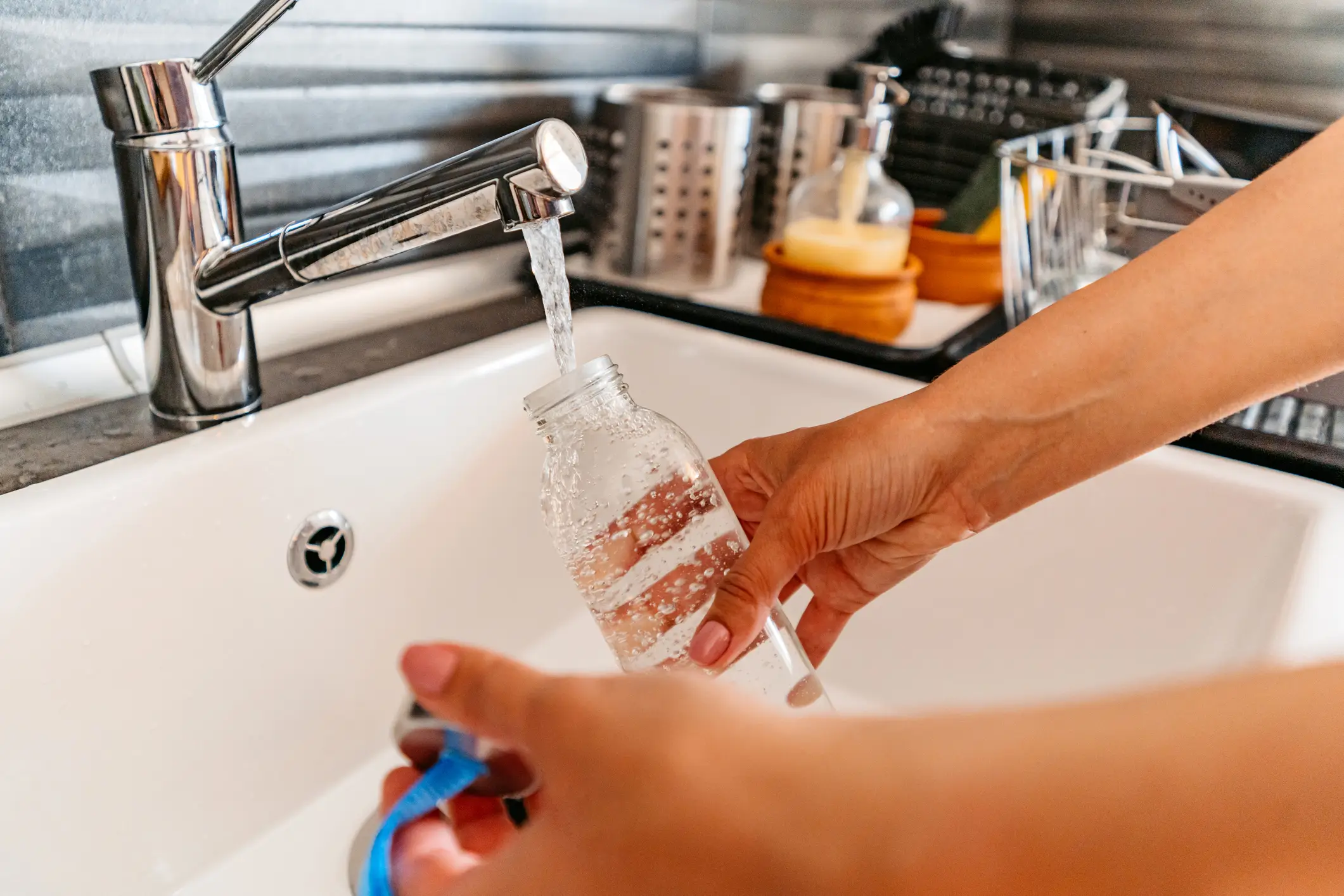 Turns out, your water bottle could be dirtier than your kitchen sink (Urbazon/Getty Images)