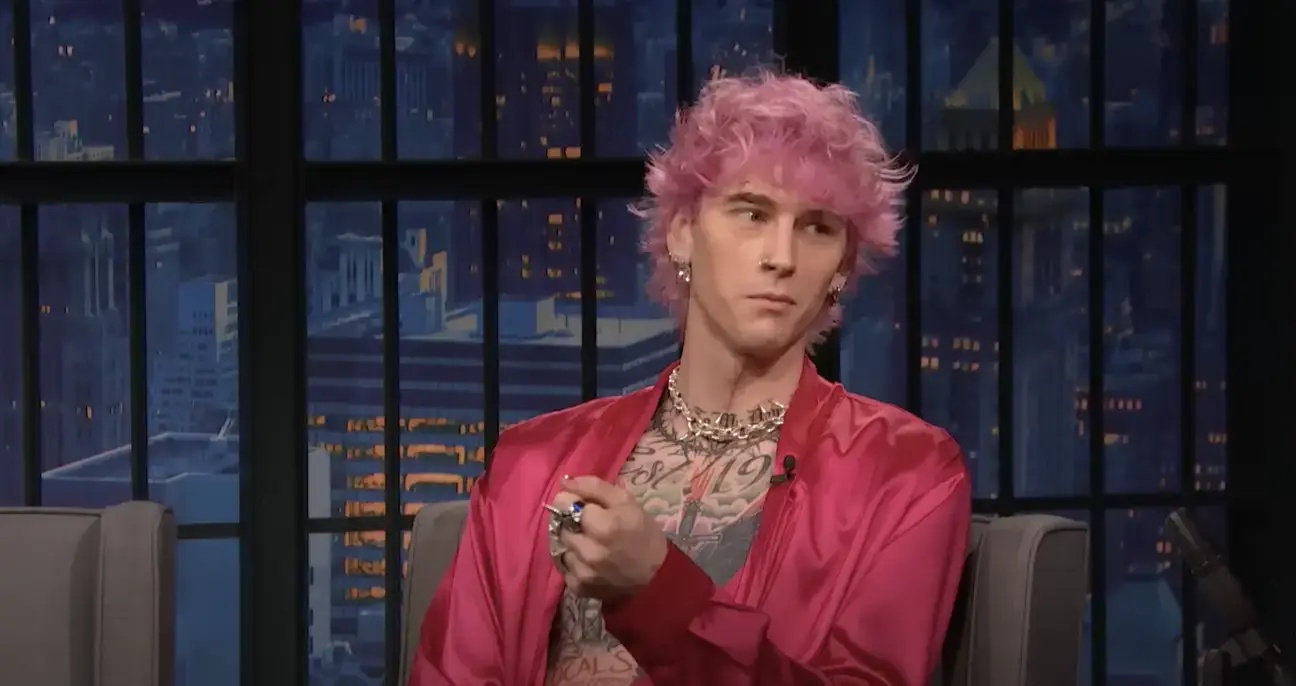 MGK explained why he smashed a glass in his face on Late Night with Seth Meyers.