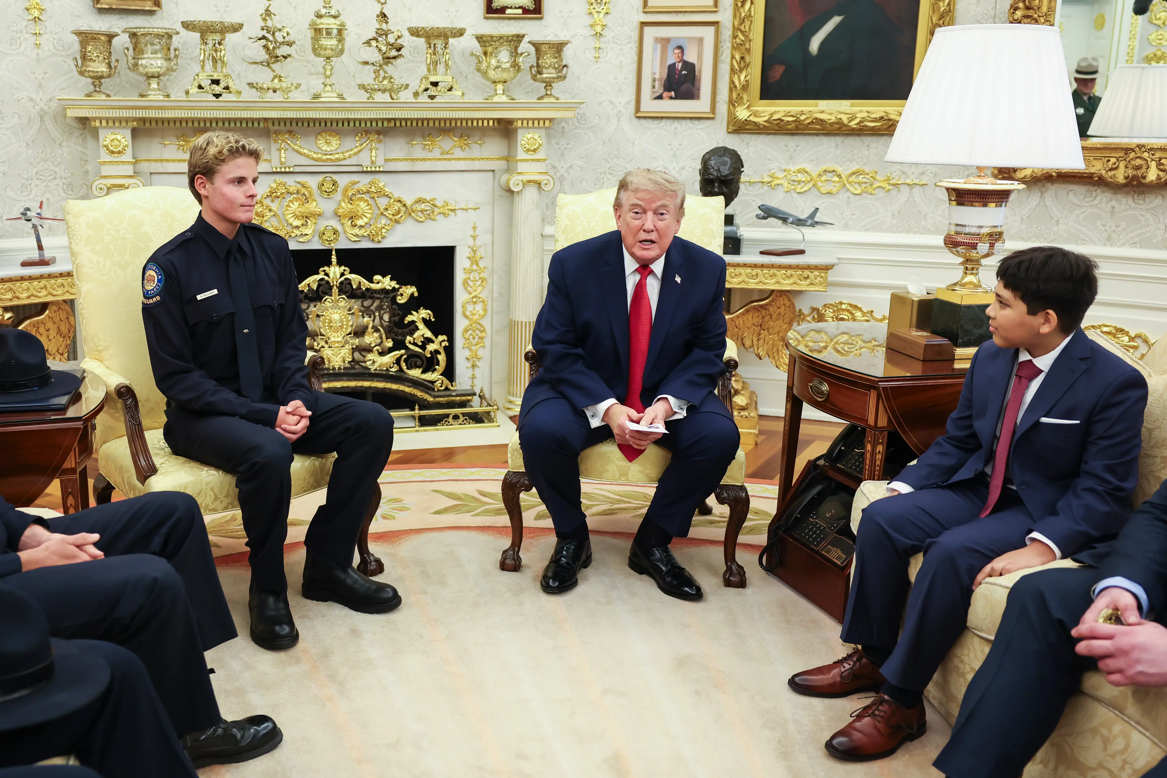 Trump bluntly told Nathaniel, the rescued boy, that he wasn't sure he would've done the same. (Samuel Corum/Sipa/Bloomberg via Getty Images)