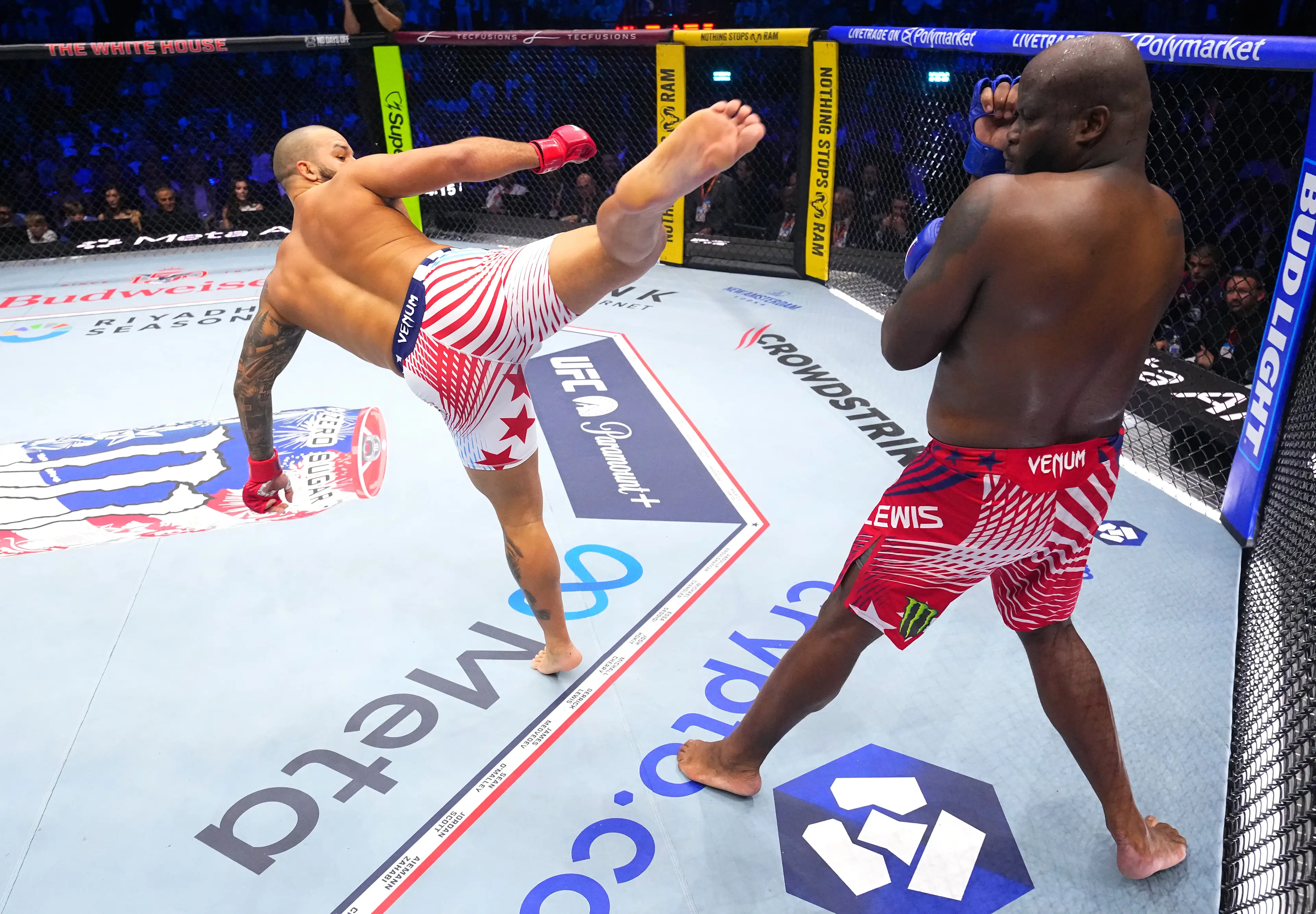 Josh Hokit strikes Derrick Lewis in a heavyweight fight during the UFC Freedom 250 event (Jeff Battari / Zuffa LLC)