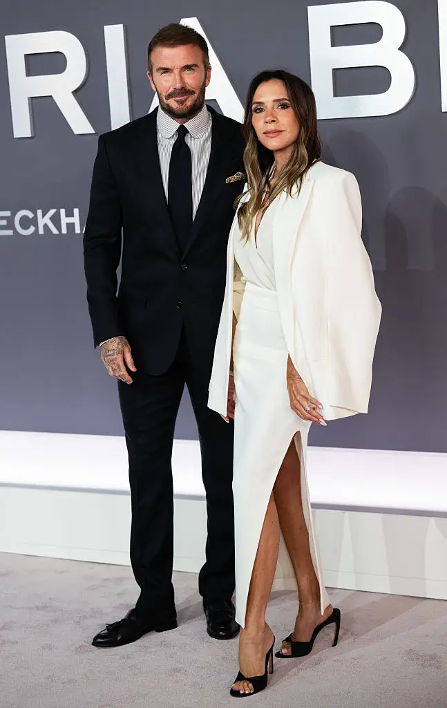 Victoria Beckham, pictured with husband David, has revealed why she is so often snapped without a smile on her face (Samir Hussein/WireImage)