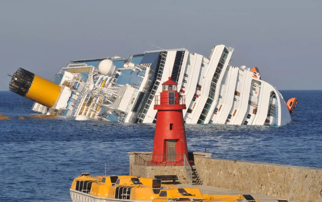 The total cost of the Costa Concordia disaster, including victims' compensation, refloating, towing and scrapping costs, is estimated at $2 billion (Photo by Laura Lezza/Getty Images)