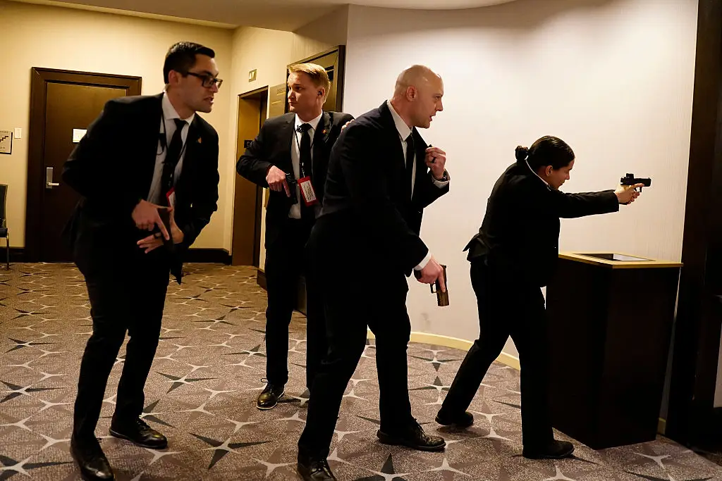 Secret Service agents rushed into action after gunshots were fired (Nathan Howard/Getty Images)
