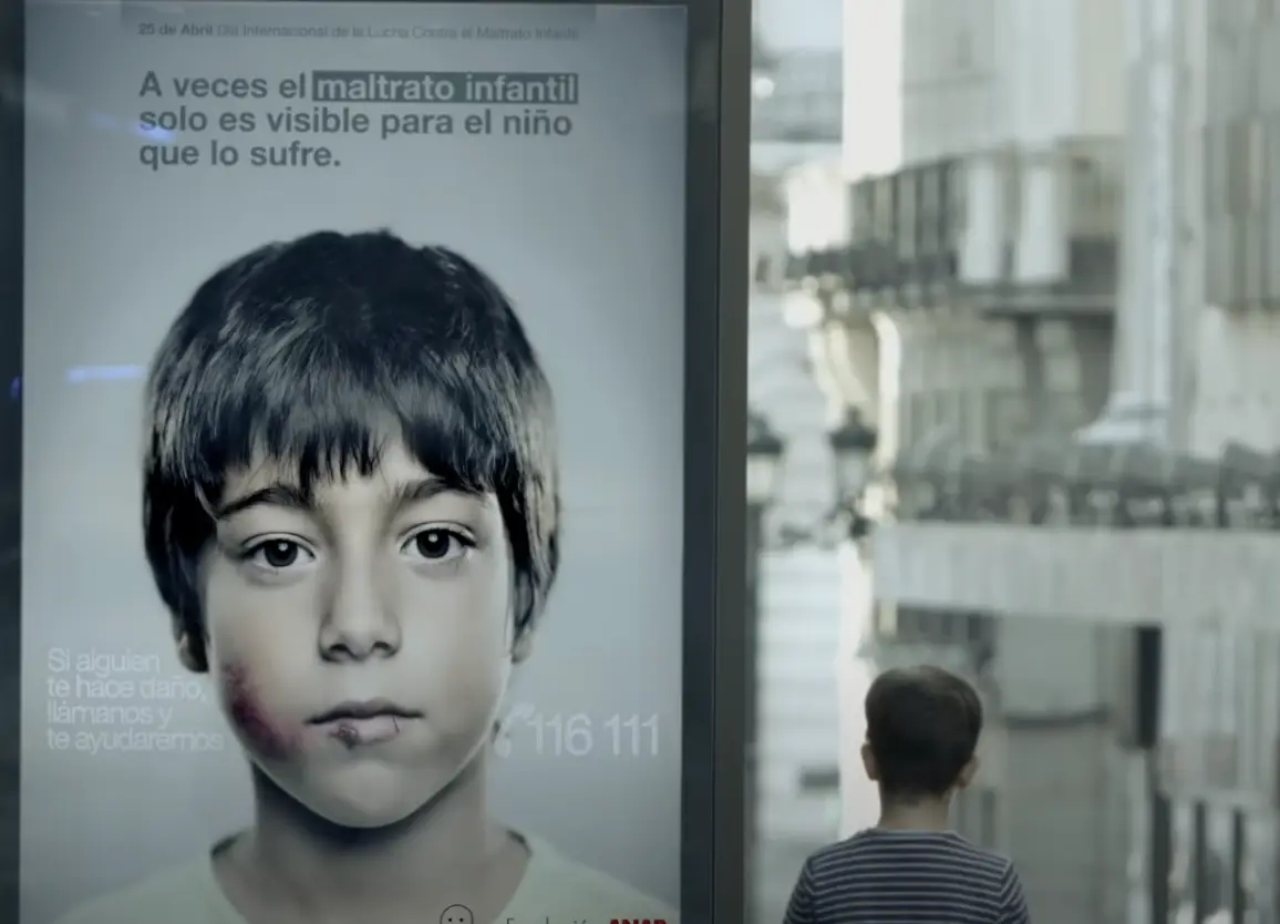 The hidden message reveals a number that children can call if they need help.