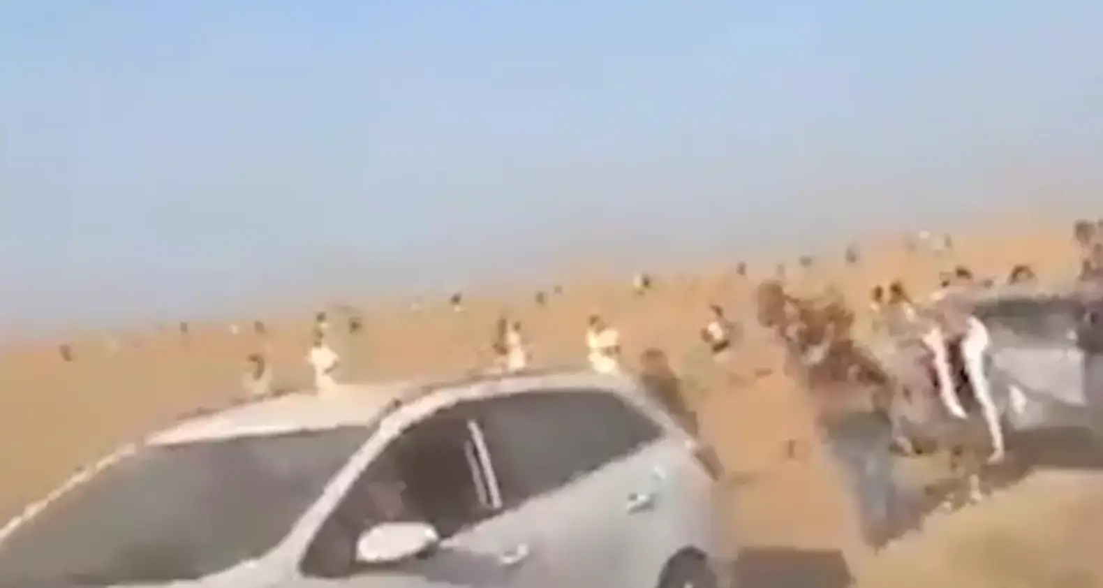 Concert-goers flee the festival following the Hamas attack.