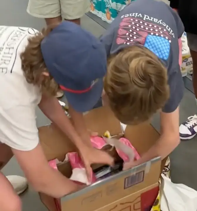 The kids were racing around trying to unwrap the boxes.