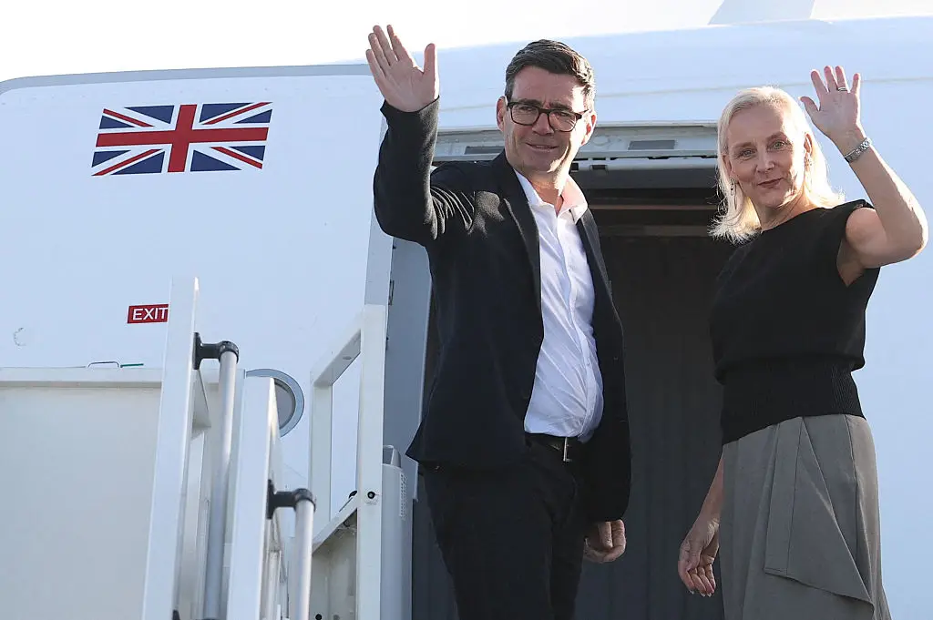 UK Prime Minister Andy Burnham and his wife Marie-France van Heel pictured boarding a plane for the United States, to attend the 81st United Nations General Assembly in New York City (Toby Melville / POOL / AFP via Getty Images)