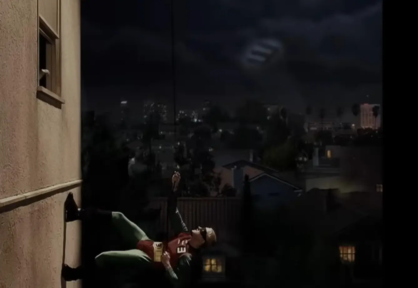 Eminem again adds in his Adam West Batman-esque wall climb. (Eminem/YouTube)