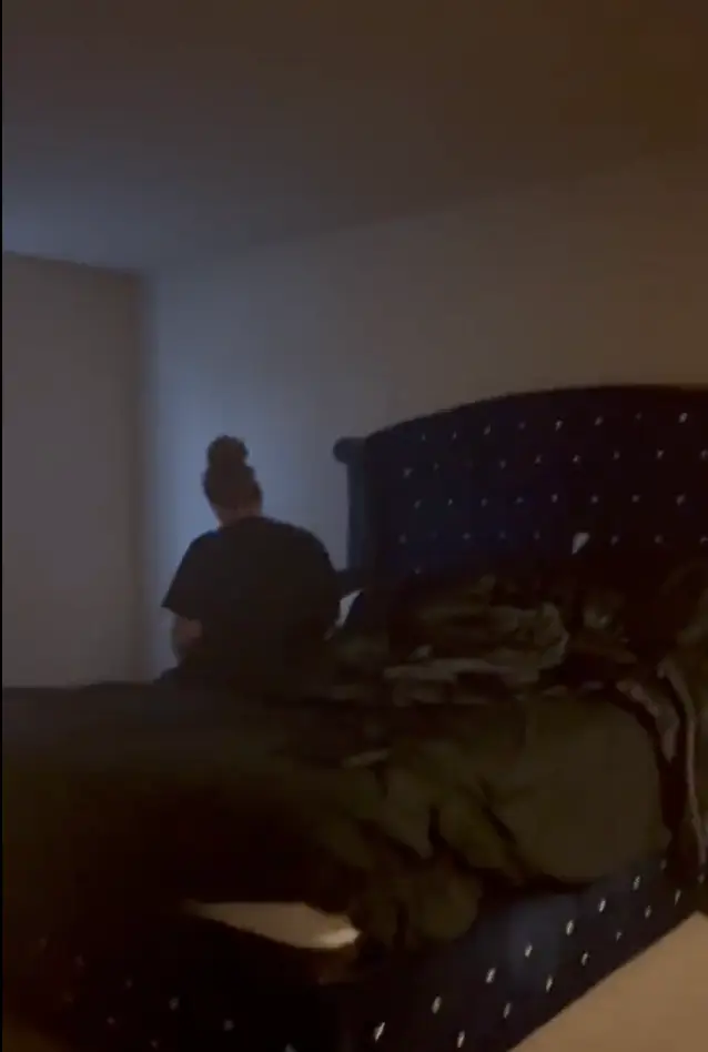 There was a woman in the bed with him.