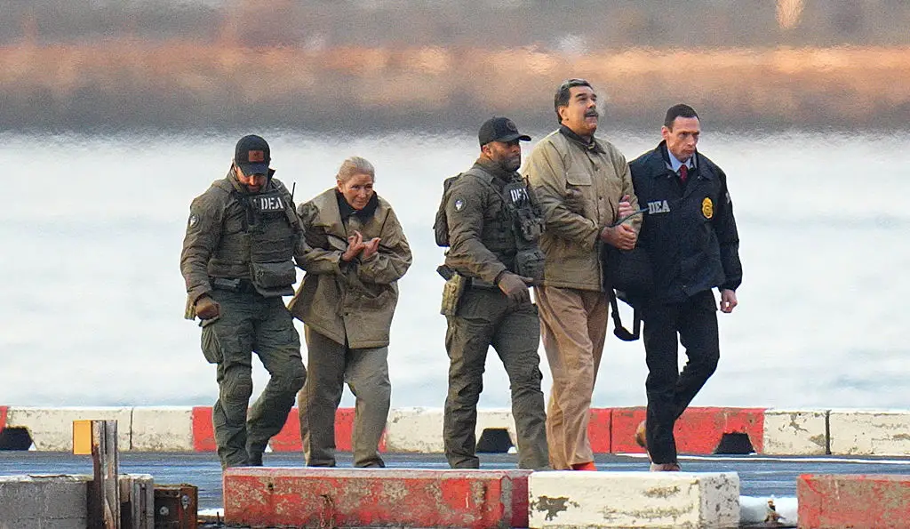 Maduro and his wife, Cilia Flores, are seen in handcuffs after landing in Manhattan earlier this year (Photo by XNY/Star Max/GC Images)
