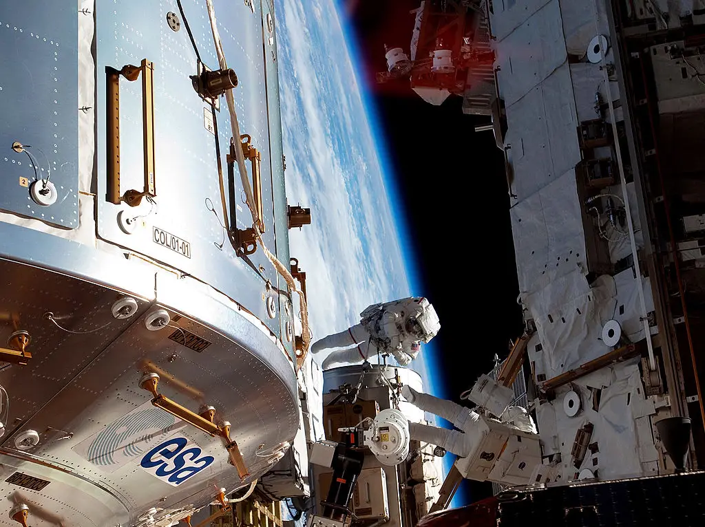 NASA astronauts Steve Bowen and Alvin Drew pictured working on the ISS in what was a six-hour-34-minute spacewalk in 2011. (NASA via Getty Images)
