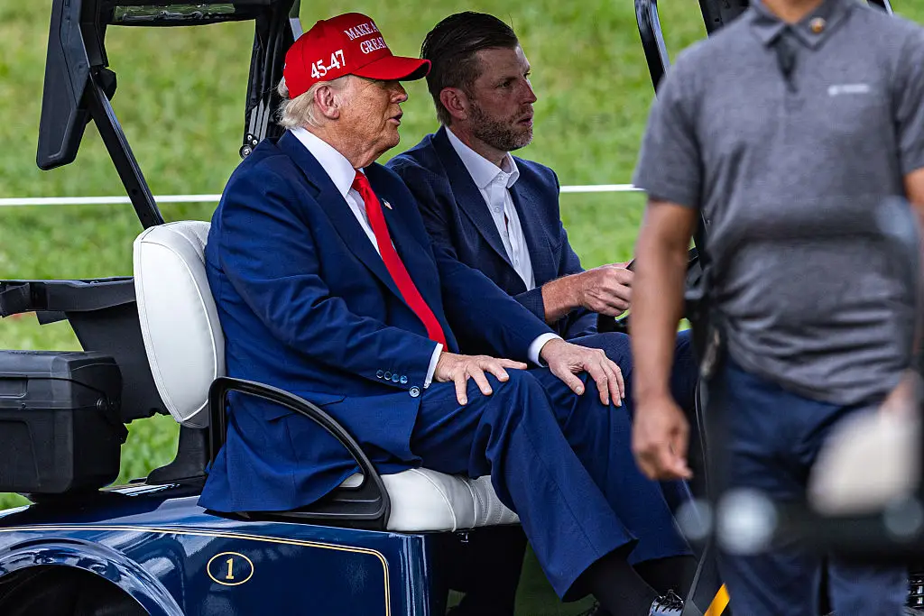 Trump with his son, Eric, playing golf in April (Lauren Sopourn/Getty Images)