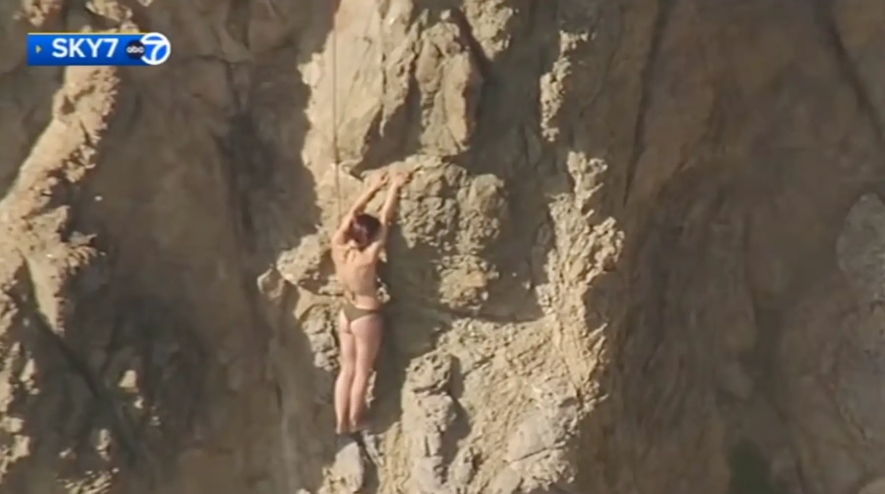 She had no choice but to cling to a rock after being swept out to sea by the strong current (ABC News)