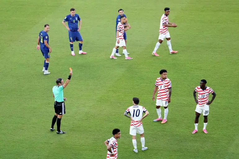 Referee Raphael Claus showed USA’s Folarin Balogun a red card for a foul on Tarik Muharemovic of Bosnia and Herzegovina [Michael Steele/Getty Images via AFP]