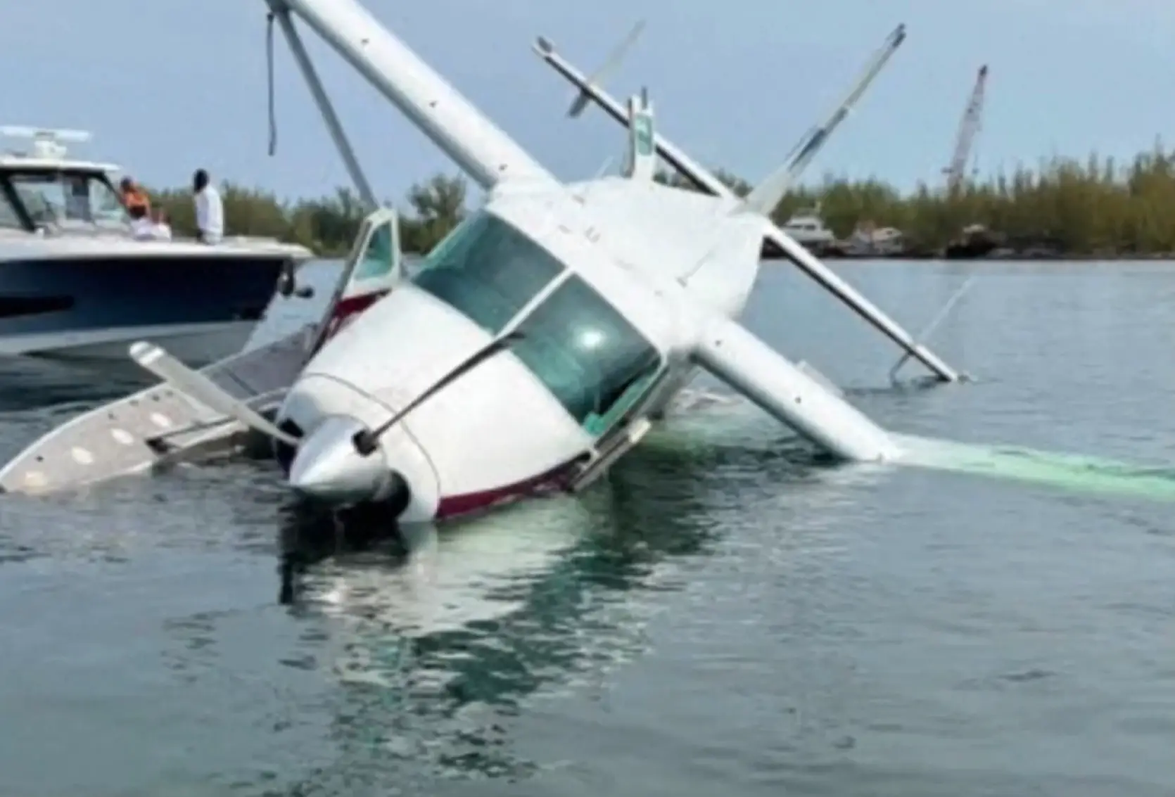 The plane was seen partially submerged in the water (WSNV)