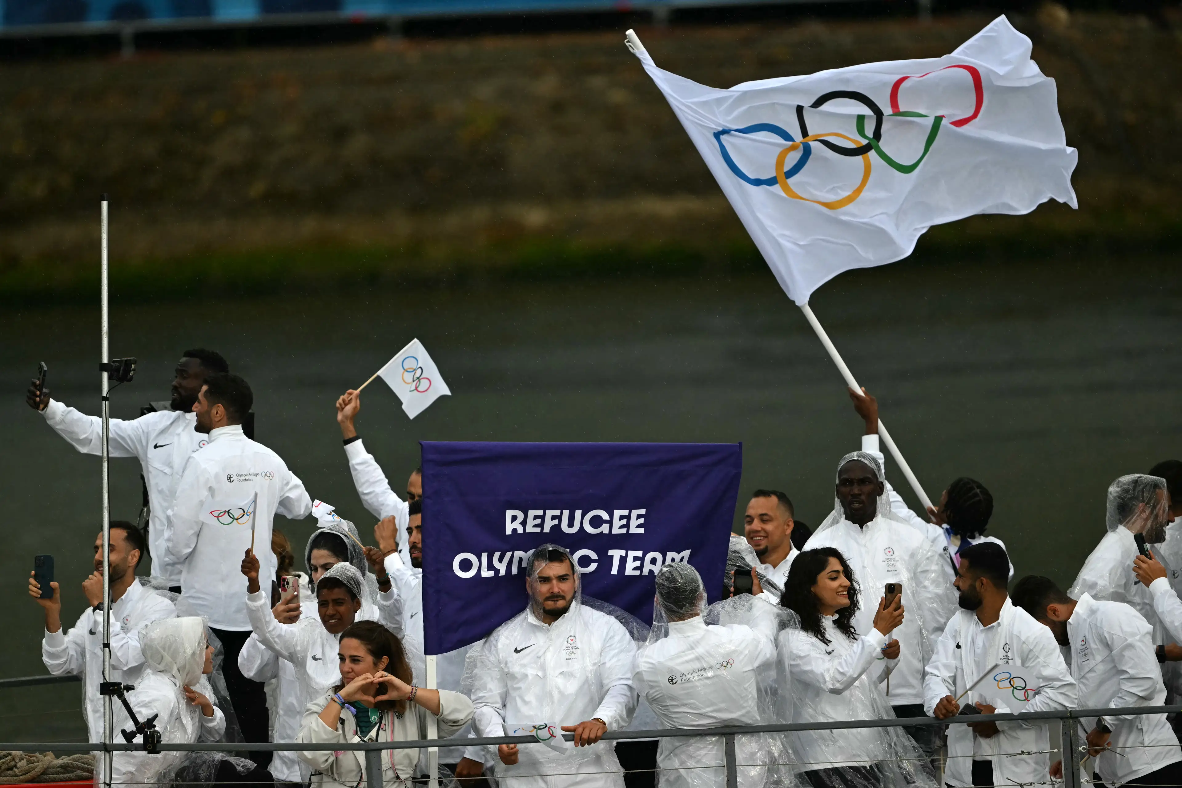 The Refugee Olympic Team at the Paris 2024 opening ceremony. (MAURO PIMENTEL/AFP via Getty Images)
