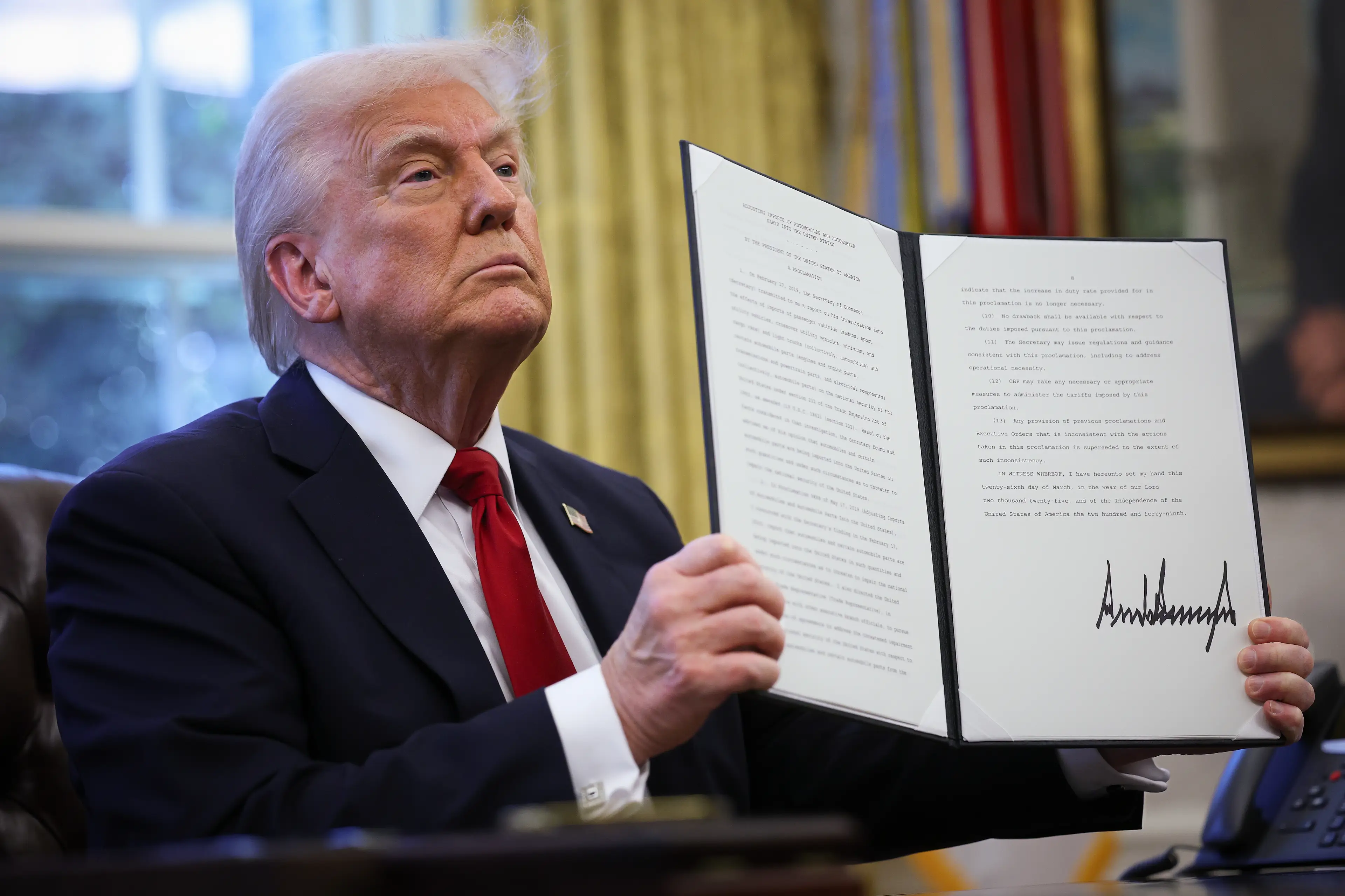 The signed executive order on foreign-made cars (Win McNamee/Getty Images) 