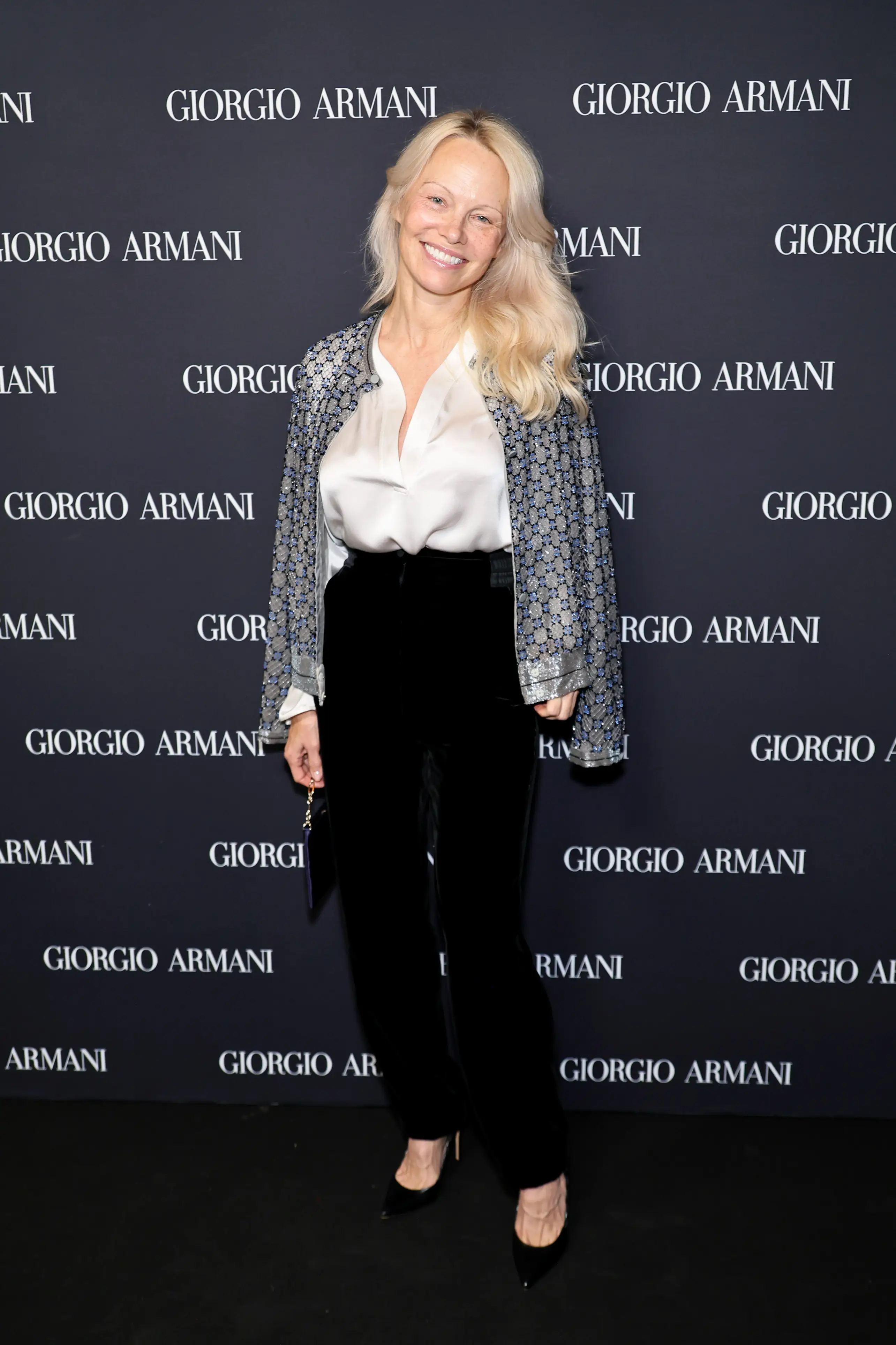 Pamela Anderson says she conducted an 'experiment' to 'peel it all back' and 'remember who she is' (Theo Wargo/Getty Images for Giorgio Armani)