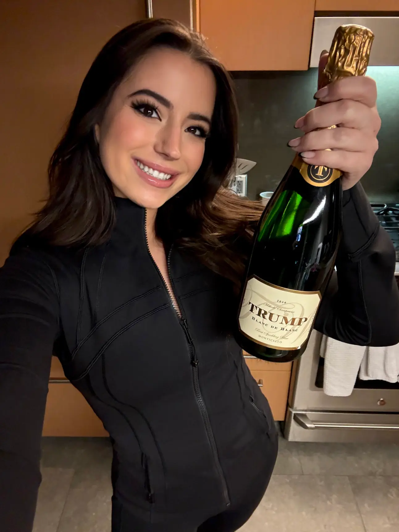 Conservative activist Ashley St Clair celebrated with a bottle of 'Trump' champagne in the days following the election, having allegedly been still dating Musk at the time (X/stclairashley)