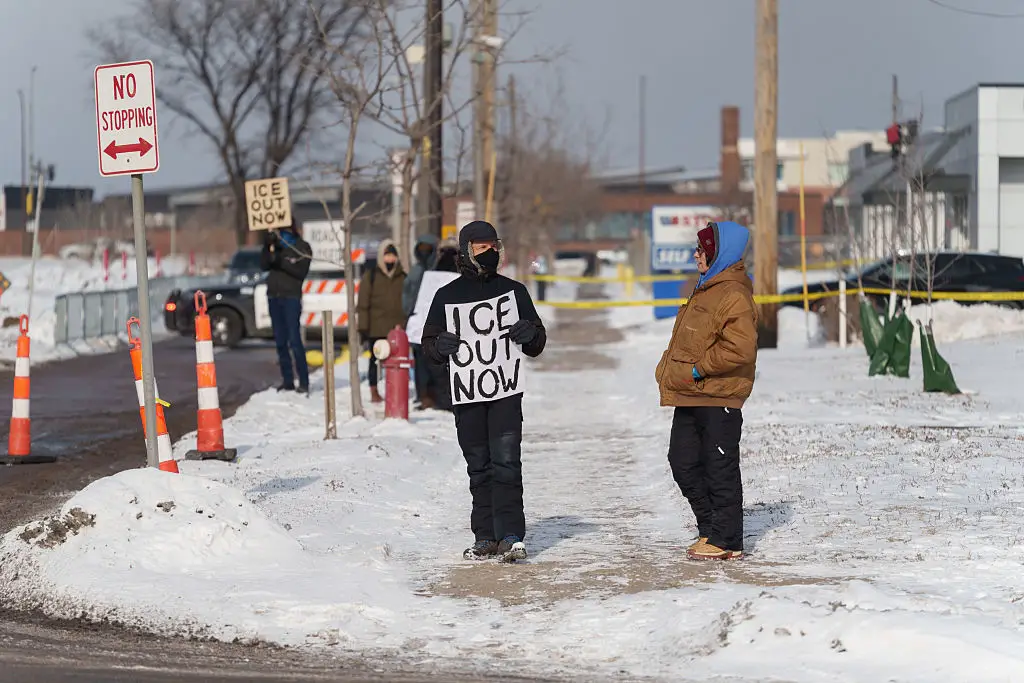 A protestor outside JD Vance's news conference in Minneapolis (Tim Evans/Bloomberg via Getty Images)