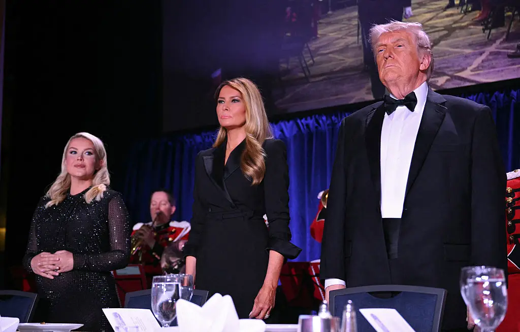 Leavitt, Melania and Trump look on at the dinner (Photo by Mandel NGAN / AFP via Getty Images)