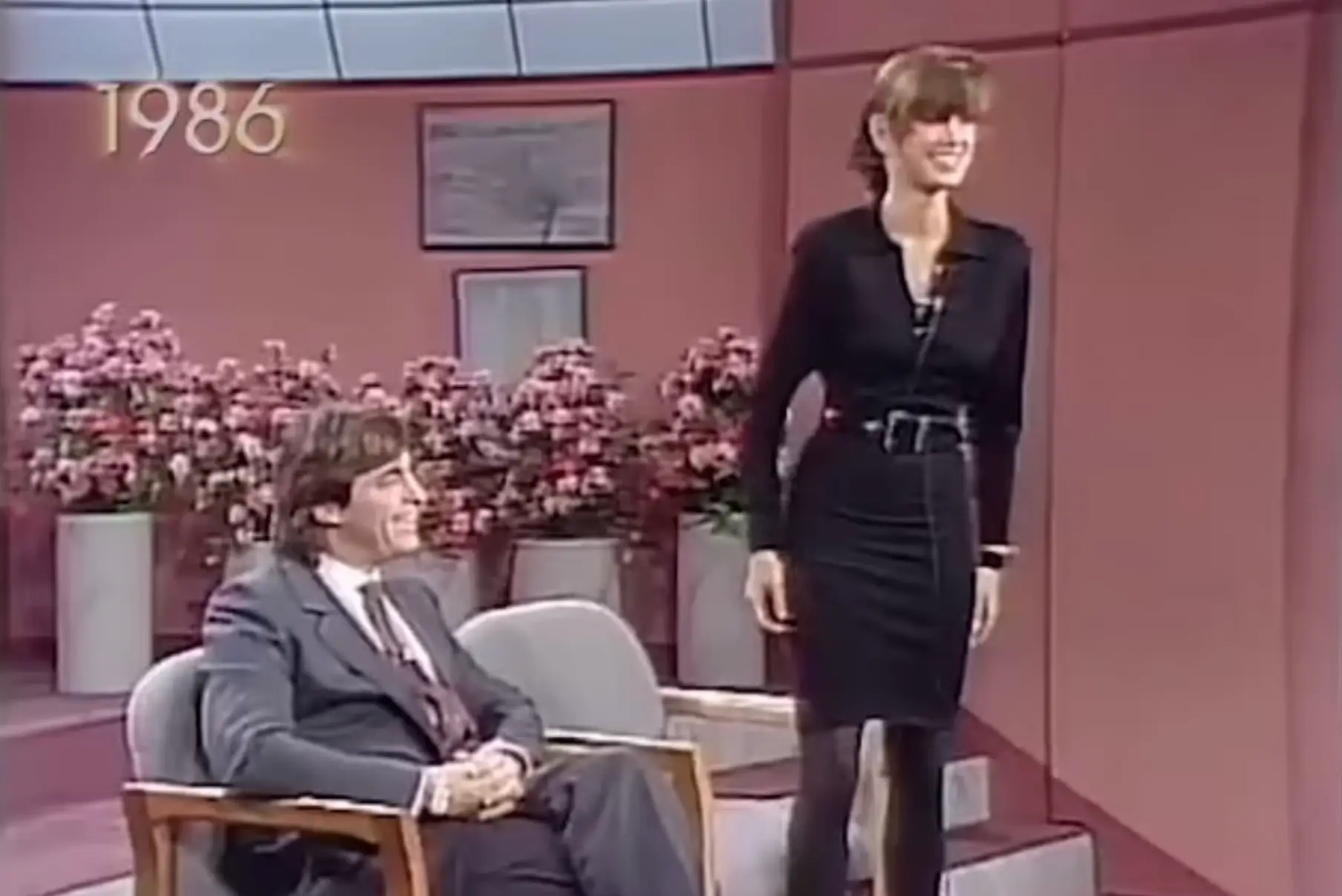 The model looks incredibly uncomfortable during the interview.