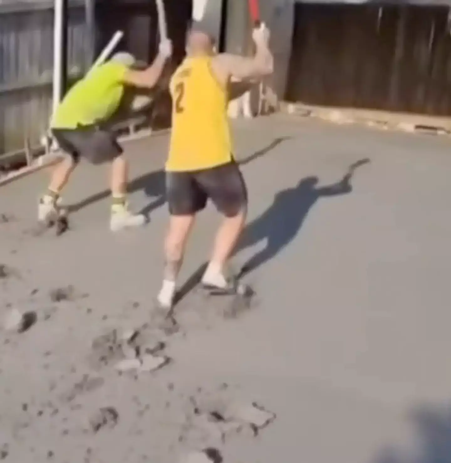 The tradesmen were filmed smashing up their work (7News)